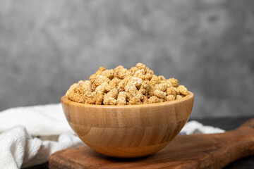 Dried mulberry. Sun-dried organic white dried mulberry in wooden bowl. Superfood, Vegetarian food concept. healthy snacks
