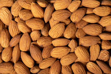 Almond. Pattern Organic almond nut raw peeled closeup food background. Top view. Texture. Copy space banner
