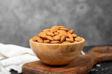Almond. Organic almond nut in wooden bowl. Superfood, Vegetarian food concept. healthy snacks