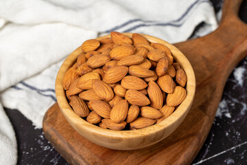 Almond. Organic almond nut in wooden bowl. Superfood, Vegetarian food concept. healthy snacks. Close up