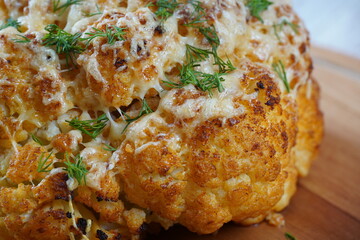 Homemade Whole Roasted Cauliflower with cheese and herbs