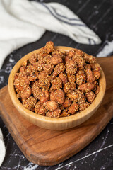 Honey with sesame peanuts. Sesame peanuts in wooden bowl. Superfood, Vegetarian food concept. healthy snacks. Close up