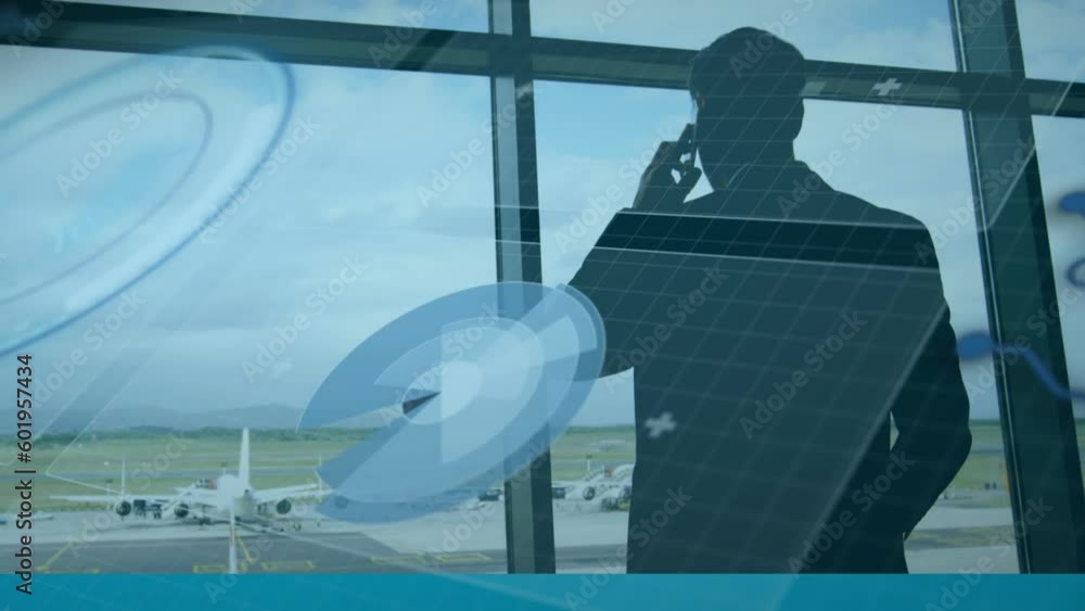 Poster animation of data processing against rear view of a businessman talking on smartphone at an airport