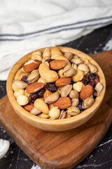 Mixed nuts. Special mixed nuts in wooden bowl. Hazelnut, almond, cashew, pistachio, dried blueberry. Superfood. Vegetarian food concept. healthy snacks. Close up
