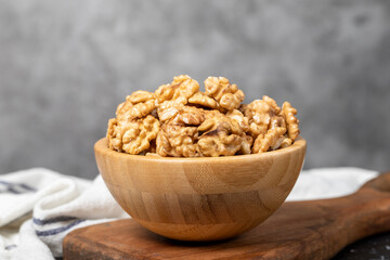 Walnut. Walnut kernel in wooden bowl. Superfood. Vegetarian food concept. Healthy snacks