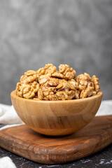 Walnut. Walnut kernel in wooden bowl. Superfood. Vegetarian food concept. Healthy snacks. Close up