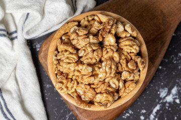 Walnut. Walnut kernel in wooden bowl. Superfood. Vegetarian food concept. Healthy snacks. Top view