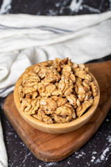 Walnut. Walnut kernel in wooden bowl. Superfood. Vegetarian food concept. Healthy snacks. Close up