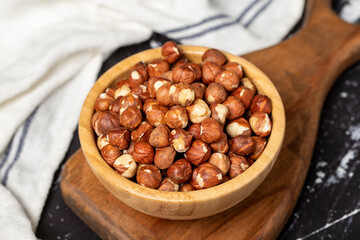 Hazelnut. Peeled hazelnuts in wooden bowl. Superfood. Vegetarian food concept. Healthy snacks. Close up