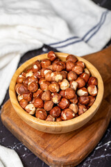 Hazelnut. Peeled hazelnuts in wooden bowl. Superfood. Vegetarian food concept. Healthy snacks. Close up