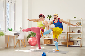 Overweight woman and her personal sports trainer doing fitness workout at home. Fat woman and thin...