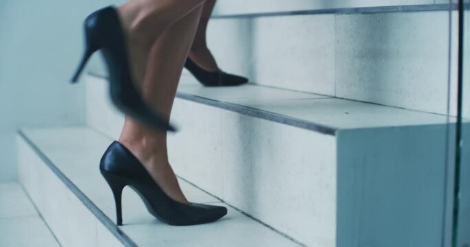 Shoes, business and women walking on steps in an office for corporate, professional or executive success closeup. Teamwork, feet or high heels with female work colleagues taking a walk on a staircase