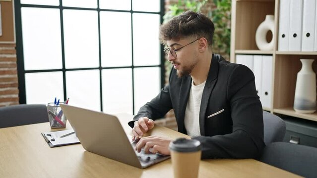 Young arab man business worker having video call working at office