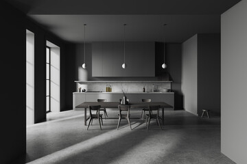 Grey home kitchen interior with cooking and dining space with window