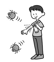 虫除けスプレーを使う男性　白黒