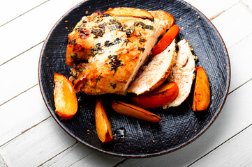 Roasted or grilled chicken breast with persimmons.
