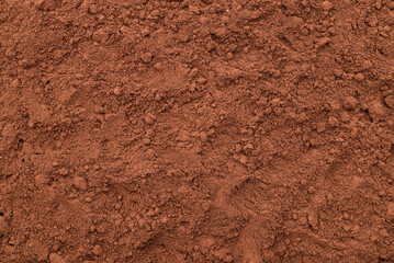 Heap of freshly ground coffee on the table. Close-up. Top view.