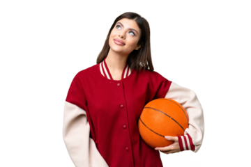 Young Russian woman playing basketball over isolated chroma key background thinking an idea while looking up