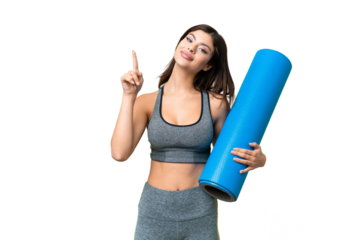 Young sport woman going to yoga classes while holding a mat over isolated chroma key background showing and lifting a finger in sign of the best