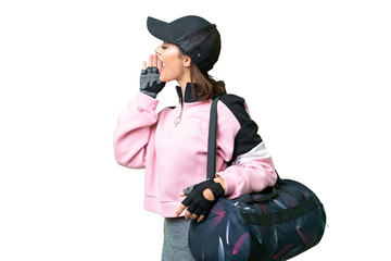 Young sport woman with sport bag over isolated chroma key background shouting with mouth wide open to the lateral