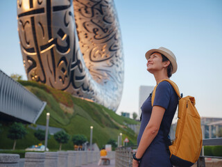 20 March 2023, Dubai, UAE: happy Tourist against background of the Future Museum