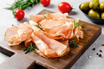 Cured Meat Platter, Prosciutto Crudo or Jamon with Spices, Antipasto, Appetizer over Bright Concrete Background