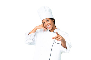 Young African American chef over isolated chroma key background making phone gesture and pointing front