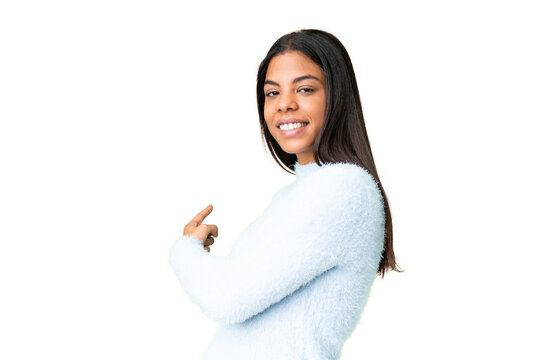 Young African American woman over isolated chroma key background pointing back