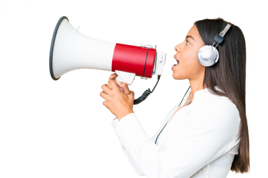 Telemarketer African American woman working with a headset over isolated chroma key background shouting through a megaphone