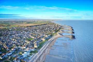 Fototapeta premium Aerial photo along the coastline from Middleton Sea in West Sussex towards Elmer and the Elmer Rock Islands sea defence.