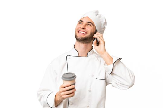 Young handsome chef man over isolated background holding coffee to take away and a mobile