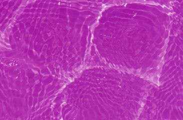 Purple water with ripples on the surface. Defocus blurred transparent pink colored clear calm water surface texture with splashes and bubbles. Water waves with shining pattern texture background.