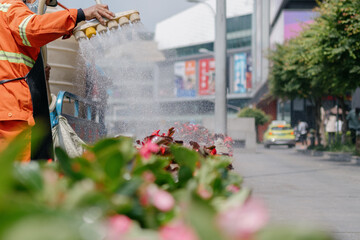 Worker watering the garden