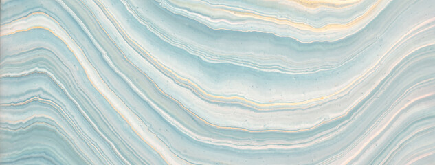 Abstract fluid art background light blue and golden colors. Liquid marble. Acrylic painting with sky gradient.
