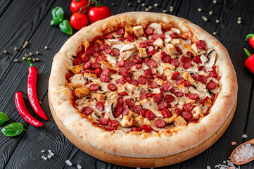Big and tasty pizza with different types of meat