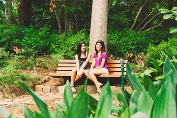 sisters sitting in the bench