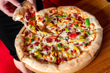 Tasty and big pizza with different types of meat