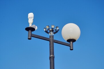 The electric light bulbs with a blue sky