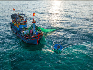 Fishing trawlers are fishing in the sea by huge net in Phu Yen, Vietnam