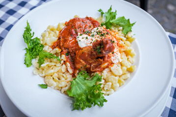 Hungarian traditional food in Szentendre, chicken paprika.