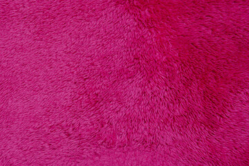 Luxury fashionable of pink fur coat texture for background It's soft winter fashion hanging. 