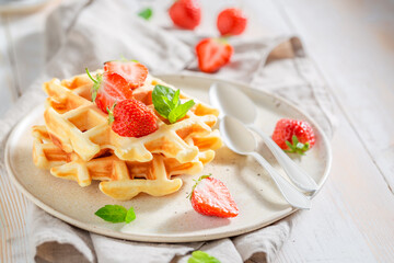 Delicious and hot wafers with strawberries and mint.