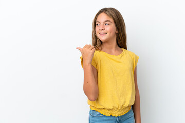 Little caucasian girl isolated on white background pointing to the side to present a product