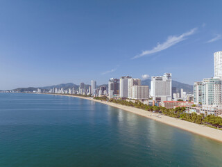 Obraz premium Nha Trang landscape with beach and high-rise buildings, famous vacation destination in Khanh Hoa, Vietnam