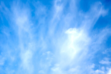 Naklejka na ściany i meble Light bright blue peaceful sky with white cirrus clouds