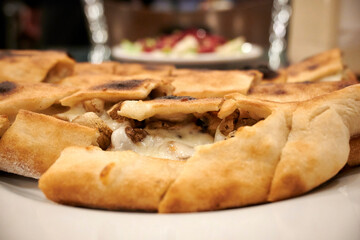 A typical Turkish meal of Pide pizza, fresh and full of flavour. A perfect dish for any food lover!