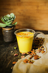 Badam sharbat, Almond milk syrup with saffron served in glass isolated on table top view of drink