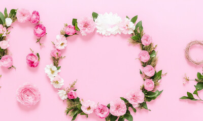 Different small flowers in a wreath on pink background with copy space. Abstract natural floral frame layout with text space. Romantic feminine flatlay (Generative AI) - obrazy, fototapety, plakaty