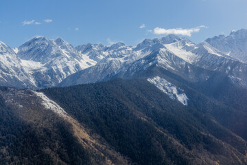 Fototapeta na wymiar Snow covered peaks in Sichuan province, China