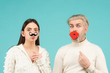 Concept of gender equality, equal rights for both sexes. Identity transgender, gender stereotypes. Funny couple of woman with moustache and man with red lips.